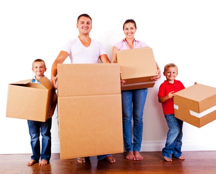 Student removals team assisting with packed boxes in an Enfield property