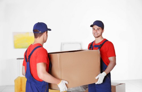 Furniture collection team handling bulky household items in Enfield