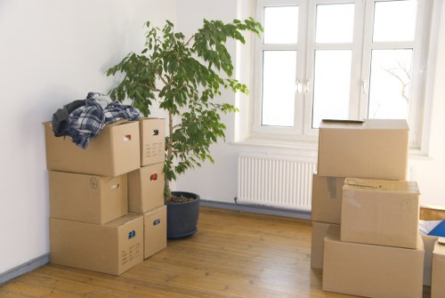 Movers handling desks and equipment during an Enfield office relocation