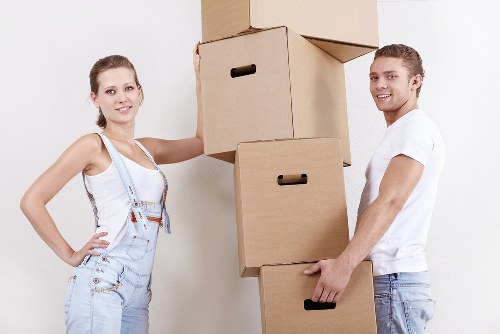 Worker moving items carefully in a property